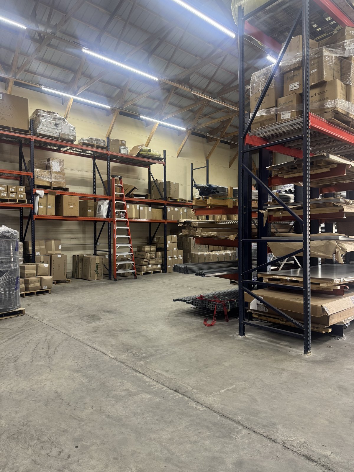HVAC supplies and accessories organized in warehouse racking